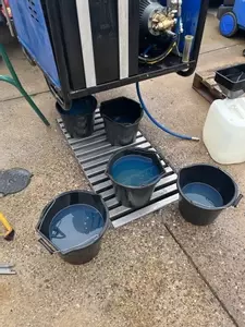 Fuel tank being drained and cleaned during industrial diesel hot pressure washer repair in Dover.